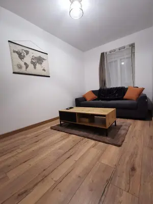 Coin salon dans l'établissement Appartement 4 personne
