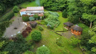 Jardin de l'établissement Chalet insolite en Forêt