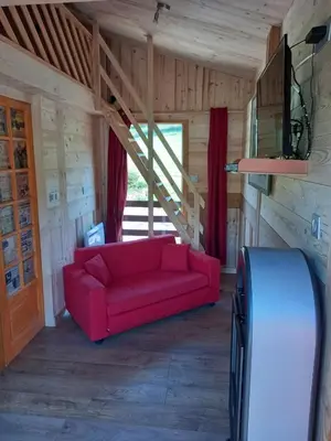 Coin salon dans l'établissement CHALET DU PERE NOEL 10 minutes from Gérardmer