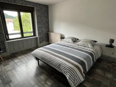 Un ou plusieurs lits dans un hébergement de l'établissement Gîte 205 m2 avec piscine et jacuzzi