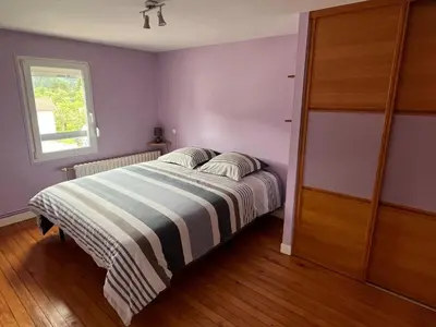 Un ou plusieurs lits dans un hébergement de l'établissement Gîte 205 m2 avec piscine et jacuzzi