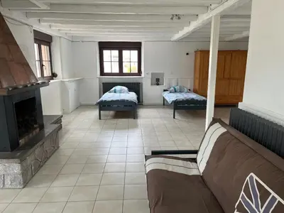 Un ou plusieurs lits dans un hébergement de l'établissement Gîte 205 m2 avec piscine et jacuzzi