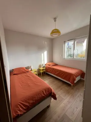 Un ou plusieurs lits dans un hébergement de l'établissement Gîte Cigogne et Sanglier