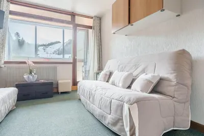 Coin salon dans l'établissement Belle Hutte - La Bresse montagne et parking privé