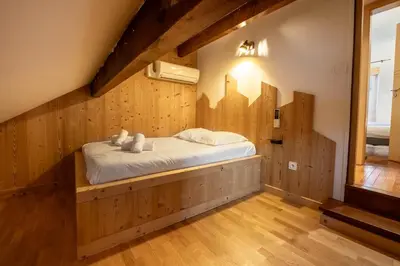 Un ou plusieurs lits dans un hébergement de l'établissement Gite Le ptit plus à Gérardmer