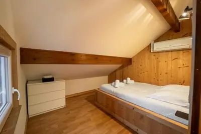 Un ou plusieurs lits dans un hébergement de l'établissement Gite Le ptit plus à Gérardmer