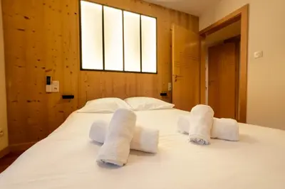 Un ou plusieurs lits dans un hébergement de l'établissement Gite Le ptit plus à Gérardmer