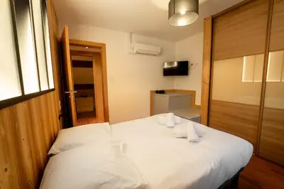 Un ou plusieurs lits dans un hébergement de l'établissement Gite Le ptit plus à Gérardmer
