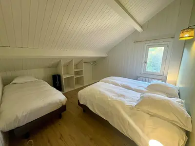 Un ou plusieurs lits dans un hébergement de l'établissement Chalet 14pers - jacuzzi&sauna - La Bresse