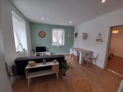 Télévision ou salle de divertissement dans l'établissement T2 Spacieux et Confortable