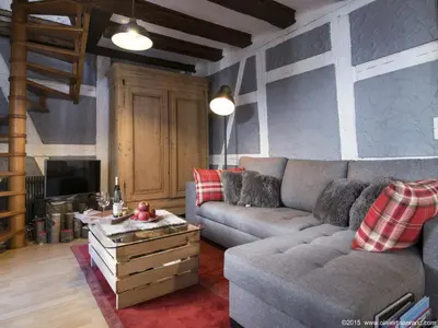 Coin salon dans l'établissement Gîte Au Coeur De Ribeauvillé