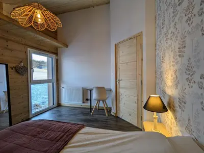 Un ou plusieurs lits dans un hébergement de l'établissement Chalet Nature avec Sauna et WIFI près Gérardmer - FR-1-589-777