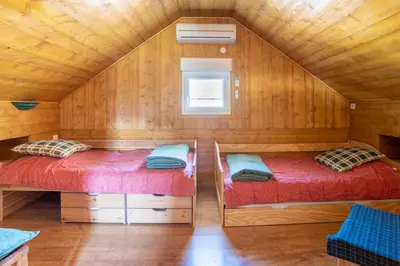 Un ou plusieurs lits dans un hébergement de l'établissement AH Large apartment 1 a 7 pers 3 stars WiFi