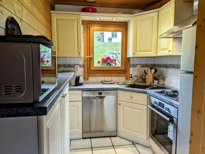 Cuisine ou kitchenette dans l'établissement Chalet bois et pierre