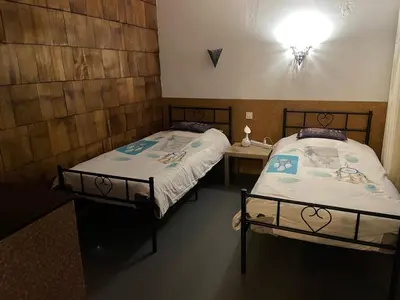 Un ou plusieurs lits dans un hébergement de l'établissement Aux balcons des xettes