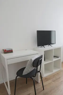 Télévision ou salle de divertissement dans l'établissement Le carré, appartement de ville