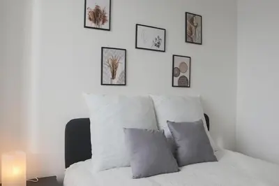 Un ou plusieurs lits dans un hébergement de l'établissement Le carré, appartement de ville