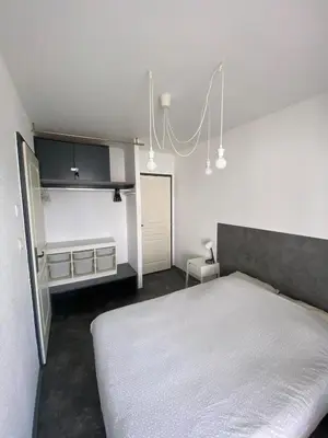 Un ou plusieurs lits dans un hébergement de l'établissement U1 Chaleureux appartement avec balcon à Uffholtz