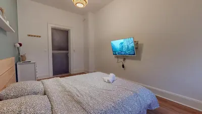 Un ou plusieurs lits dans un hébergement de l'établissement Le Majestic & Pool Mulhouse