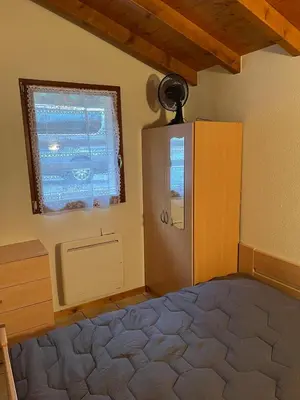Un ou plusieurs lits dans un hébergement de l'établissement Gîte La Bresse 7 personnes