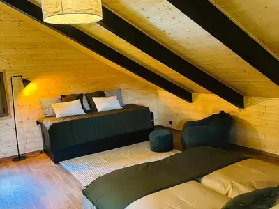 Un ou plusieurs lits dans un hébergement de l'établissement Chalet moderne avec cheminée et animaux bienvenus proche de Gérardmer - FR-1-589-778