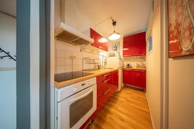 Cuisine ou kitchenette dans l'établissement Marne 29 Logement Mulhouse Proche Tram Autoroute