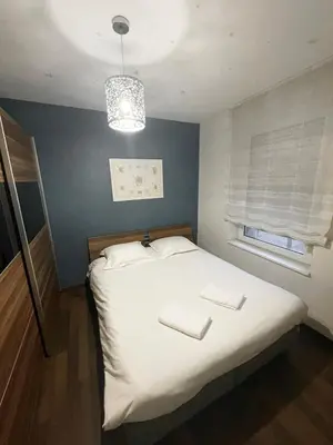 Un ou plusieurs lits dans un hébergement de l'établissement Bale 23 Magnifique Logement 6 Pers Parking Prive