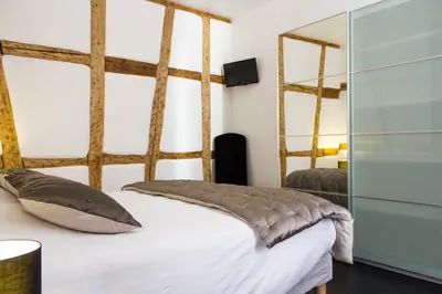 Un ou plusieurs lits dans un hébergement de l'établissement MY SWEET HOMES - Appartements avec SPA
