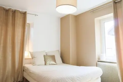 Un ou plusieurs lits dans un hébergement de l'établissement Le Bohème, Reposant & Cosy