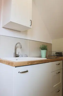 Cuisine ou kitchenette dans l'établissement La Suite Allure