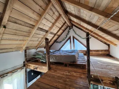 Un ou plusieurs lits dans un hébergement de l'établissement Chalet de la Comté