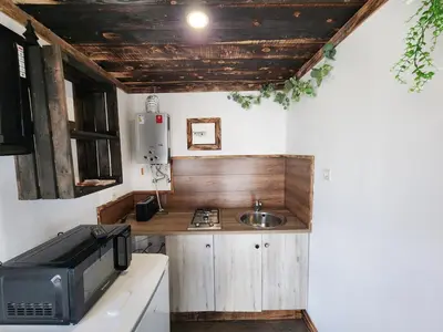 Cuisine ou kitchenette dans l'établissement Chalet de la Comté