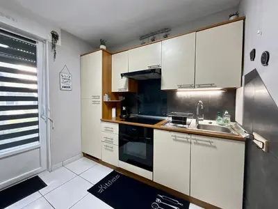 Cuisine ou kitchenette dans l'établissement Le Cosy Blanchepierre, bel appartement classé 3 étoiles