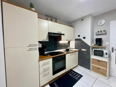 Cuisine ou kitchenette dans l'établissement Le Cosy Blanchepierre, bel appartement classé 3 étoiles