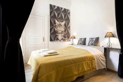 Un ou plusieurs lits dans un hébergement de l'établissement Apartments Center Colmar
