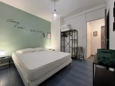 Un ou plusieurs lits dans un hébergement de l'établissement Spacieux appartement à Belfort