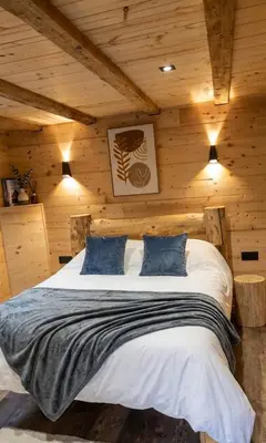 Un ou plusieurs lits dans un hébergement de l'établissement La Clochette d'Hiver Familial et espace Détente