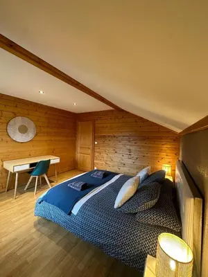 Un ou plusieurs lits dans un hébergement de l'établissement Chalet 3 Vallées - Piscine & SPA - Haut Standing