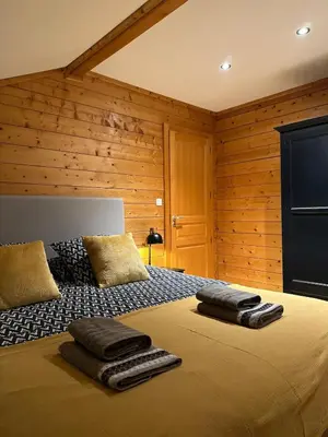 Un ou plusieurs lits dans un hébergement de l'établissement Chalet 3 Vallées - Piscine & SPA - Haut Standing