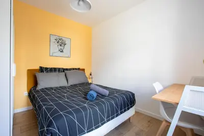 Un ou plusieurs lits dans un hébergement de l'établissement Proche centre ville, moderne & cosy, ultra calme
