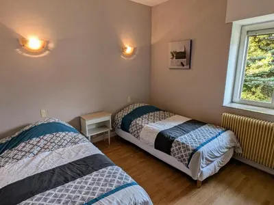 Un ou plusieurs lits dans un hébergement de l'établissement Gîte paisible au pied du Bassin de Champagney, animaux acceptés - FR-1-583-372