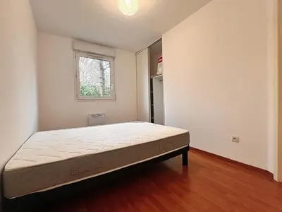 Un ou plusieurs lits dans un hébergement de l'établissement Appartement Cosy à Belfort