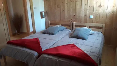 Un ou plusieurs lits dans un hébergement de l'établissement CHALET AU CALME à GERARDMER