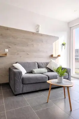 Coin salon dans l'établissement studio tout équipé, calme avec terrasse et parking