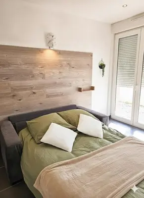 Un ou plusieurs lits dans un hébergement de l'établissement studio tout équipé, calme avec terrasse et parking