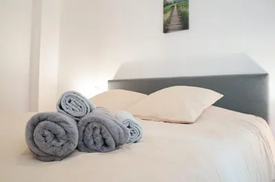 Un ou plusieurs lits dans un hébergement de l'établissement Duplex Harmonie proche frontière