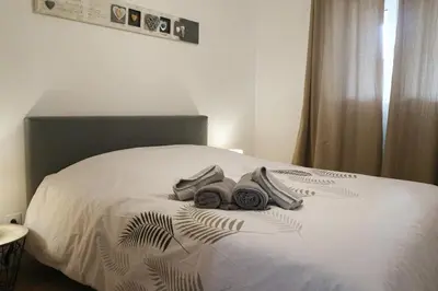 Un ou plusieurs lits dans un hébergement de l'établissement Plaisir partagé Apartment
