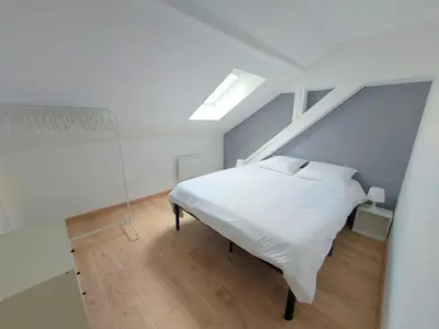 Un ou plusieurs lits dans un hébergement de l'établissement Cosy 4 - Audincourt centre