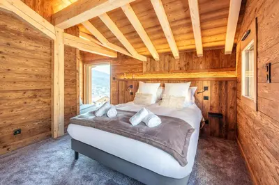 Un ou plusieurs lits dans un hébergement de l'établissement Chalet de Scott, luxe avec spa et sauna
