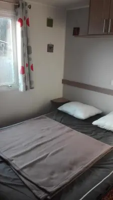 Un ou plusieurs lits dans un hébergement de l'établissement Mobilhome convivial en Alsace
